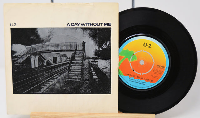 Vinyl record and cover titled 'A Day Without Me' by U2