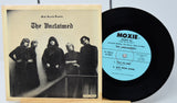 Vinyl record with cover featuring 'The Unclaimed' band and Moxie Records branding.