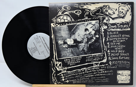 Vinyl record with cover featuring a stylized illustration of a person and text.