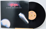 Vinyl record and cover titled 'Adventures in Utopia' on a white background