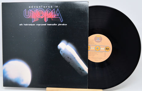 Vinyl record and cover titled 'Adventures in Utopia' on a white background