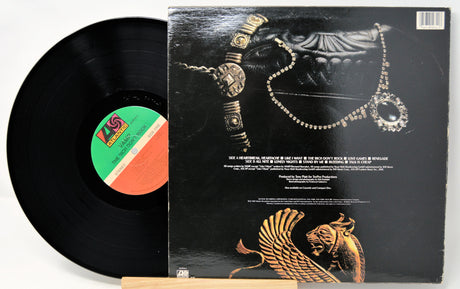 Vinyl record with a detailed cover featuring jewelry designs.