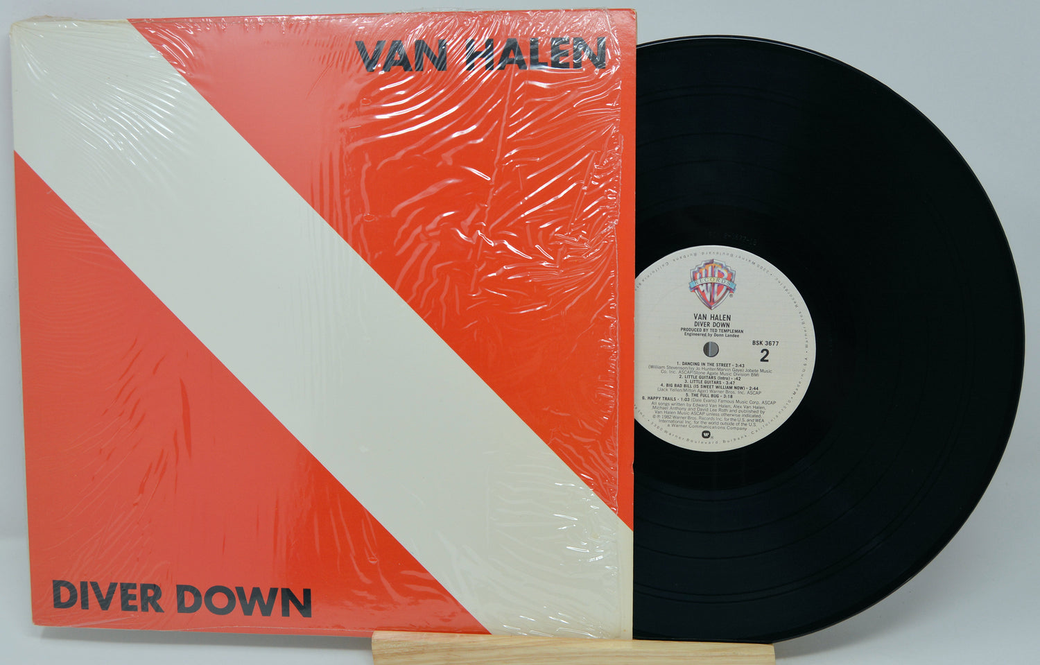 Van Halen 'Diver Down' vinyl record and cover on a white background