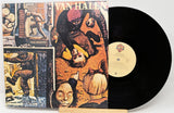 Vinyl record with a colorful album cover featuring a gorilla and text.