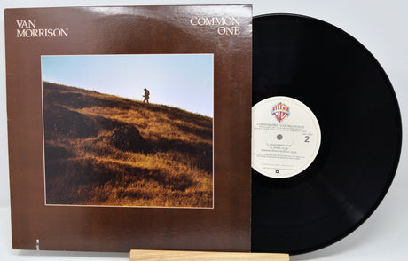 Vinyl record with a blue label and cloud-themed cover