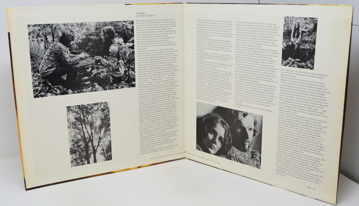 Open book with black and white photographs and text on a white background