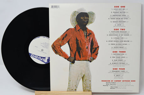 Vinyl record with a person wearing a cowboy hat and red shirt on the cover