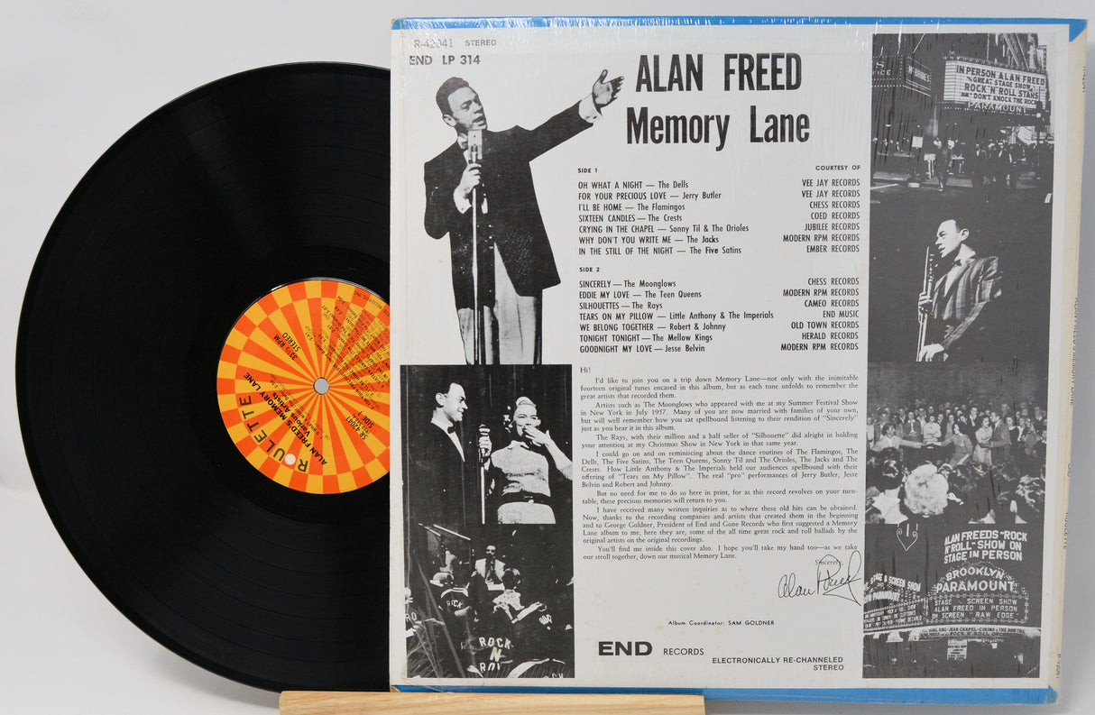 Vinyl record with cover featuring black and white images and text, including a person with a microphone.