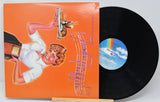 Vinyl record with cover titled 'Neil Diamond His 12 Greatest Hits' on a white background