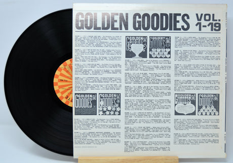 Vinyl record with a sleeve titled 'Golden Goodies Vol. 1-19' on a light blue background.