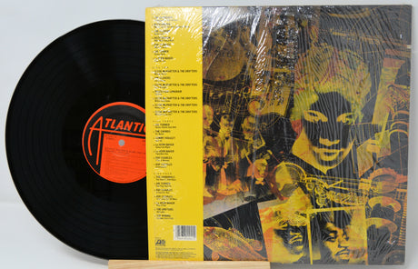 Vinyl record with a colorful cover featuring a face and text, including an 'Atlantic' label.