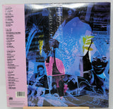 Album cover with collage of musicians and text on a gray background