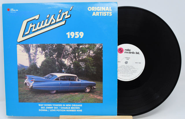 Vinyl record with blue cover featuring text and a white label on a light gray background
