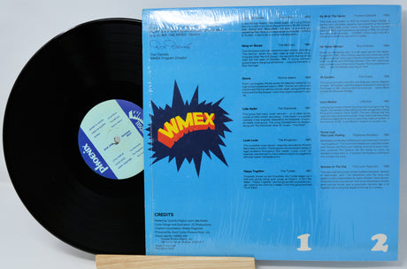 Vinyl record with blue cover featuring the Wimex logo on a white background