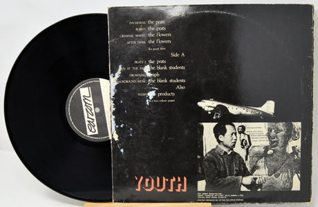 Vinyl record with a distressed cover featuring the label 'Parazm' on a light gray background
