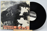 Vinyl record with a distressed cover featuring the label 'Parazm' on a light gray background