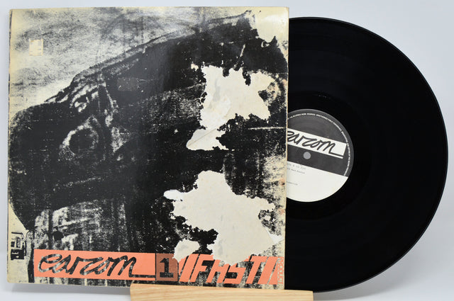 Vinyl record with a distressed cover featuring the label 'Parazm' on a light gray background