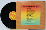Vinyl record with cover displaying 'Great Hits of the 60's' tracklist on a gradient background