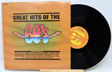 Vinyl record with cover titled 'Great Hits of the 60's' on a light blue background