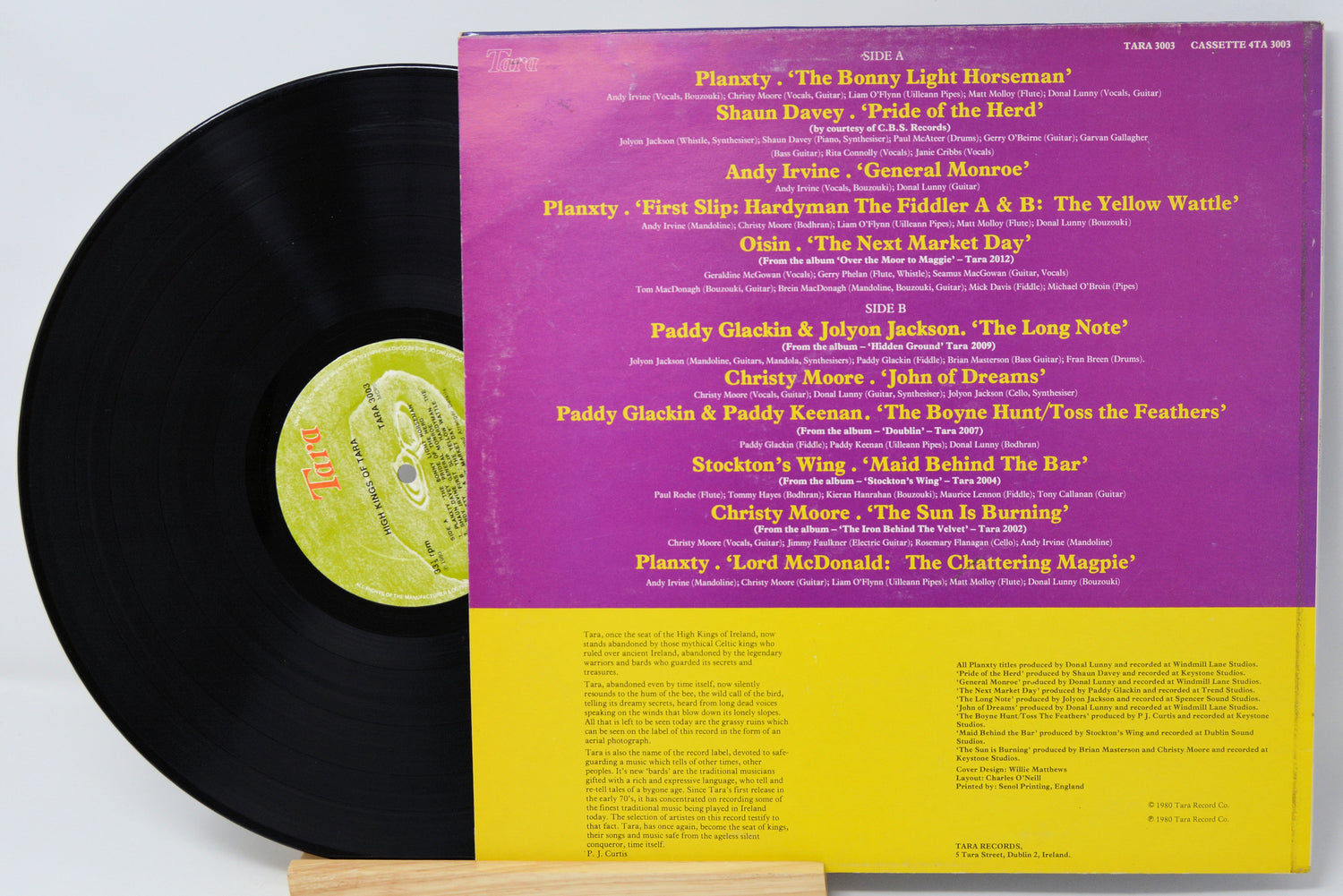 Vinyl record with a colorful cover featuring text and a green label.