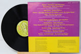 Vinyl record with a colorful cover featuring text and a green label.