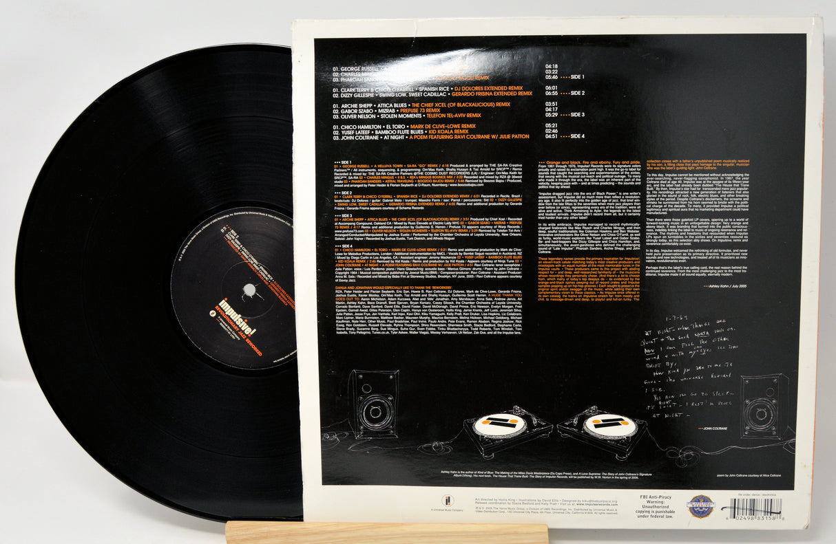 Vinyl record with a detailed cover displaying text and graphics on a white background