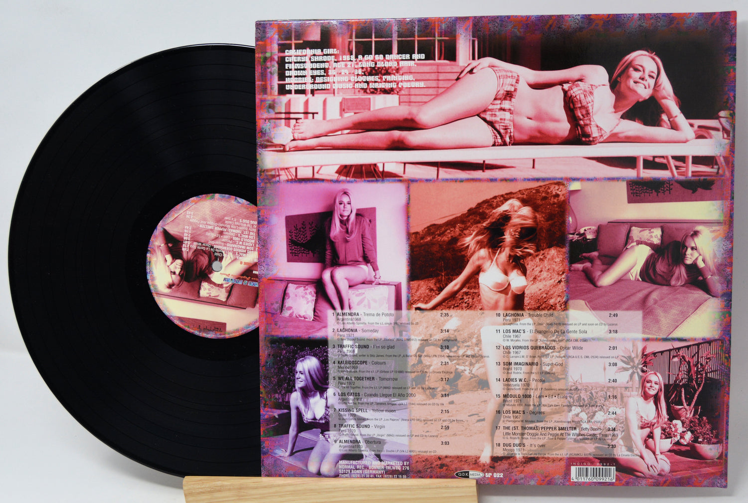 Vinyl record with a colorful album cover featuring images of a woman.