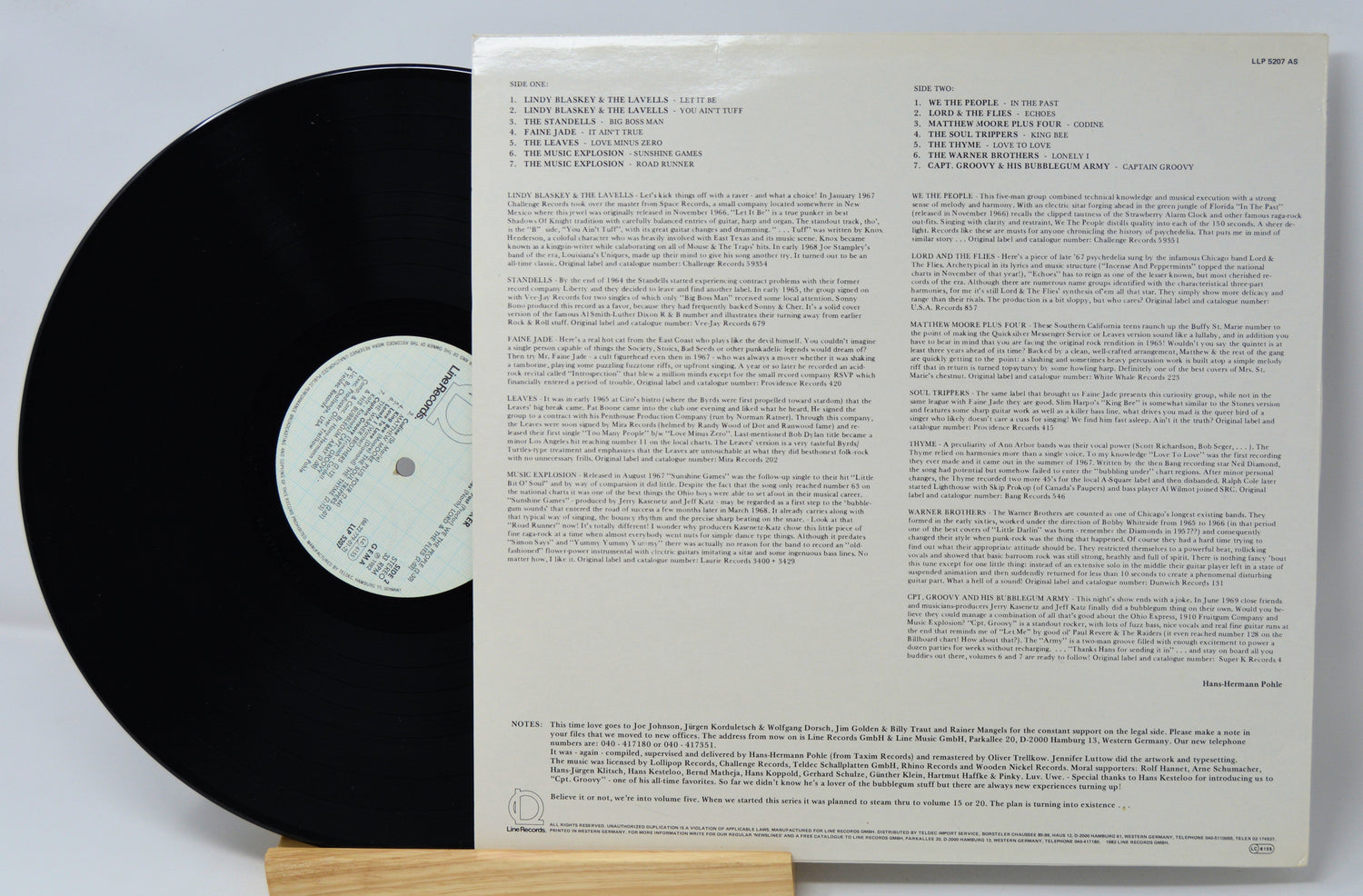 Vinyl record with text on a white background