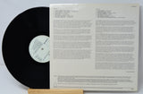 Vinyl record with text on a white background