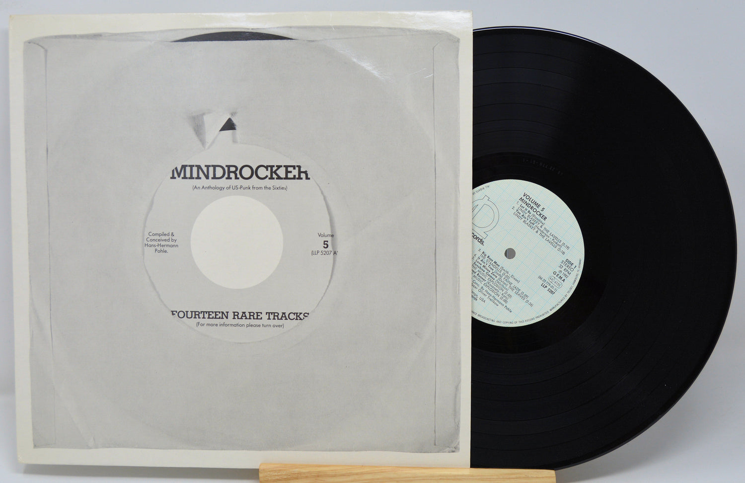 Vinyl record with cover displaying 'Mindrocker' on a white background