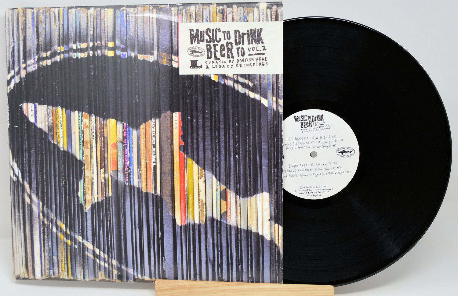 Vinyl record with colorful sleeve and visible label on a white background