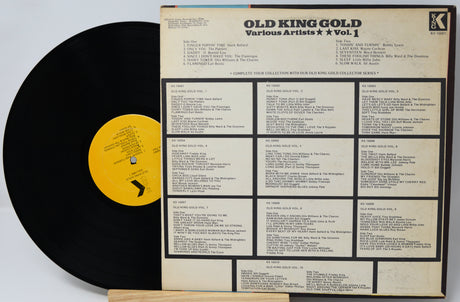 Vinyl record with yellow label and record cover displaying track listings on a white background