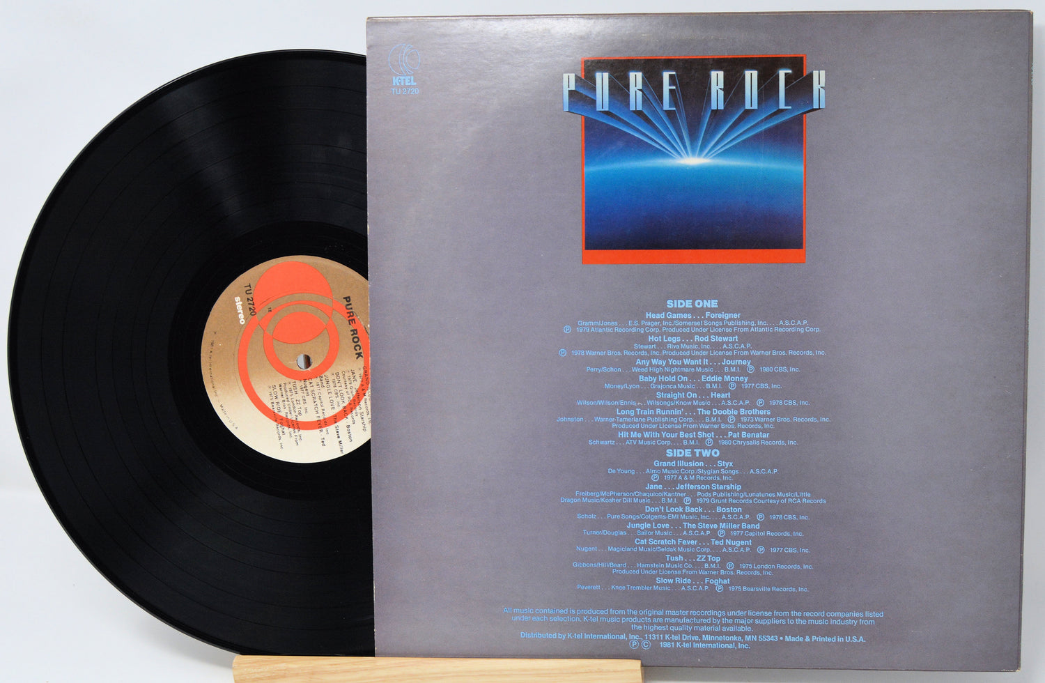 Vinyl record with cover featuring text and a logo on a white background