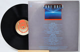 Vinyl record with cover featuring text and a logo on a white background