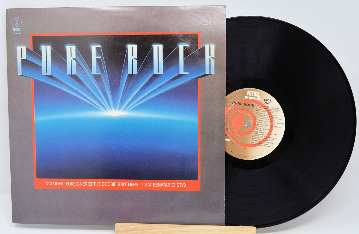Vinyl record with a 'Pure Rock' cover on a white background