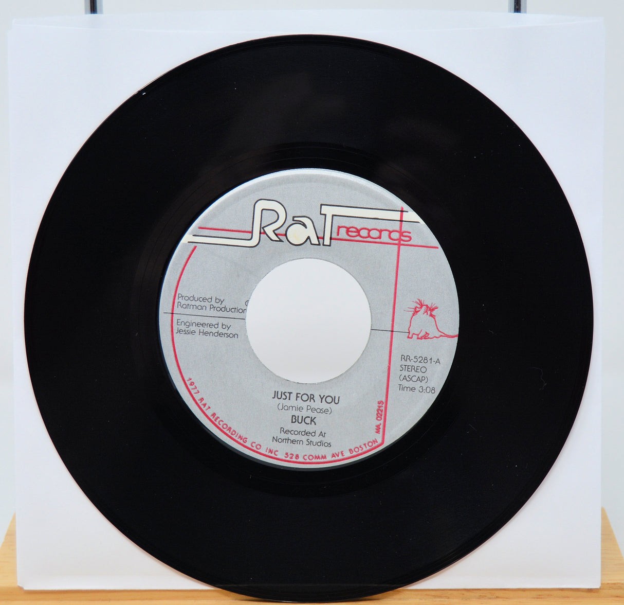 Vinyl record with 'Rat Records' label on a white background