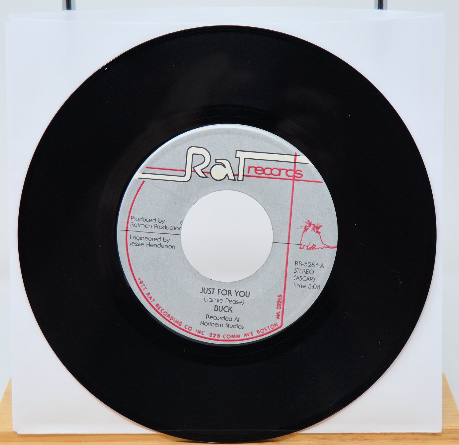 Vinyl record with 'Rat Records' label on a white background