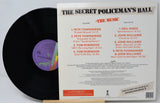 Vinyl record with cover displaying tracklist on a light gray background