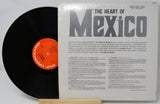 Vinyl record with a black disc and a white cover featuring text and an orange label.