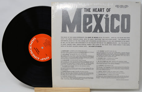 Vinyl record with a black disc and a white cover featuring text and an orange label.