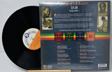 Vinyl record with its cover displaying text and images on a white background