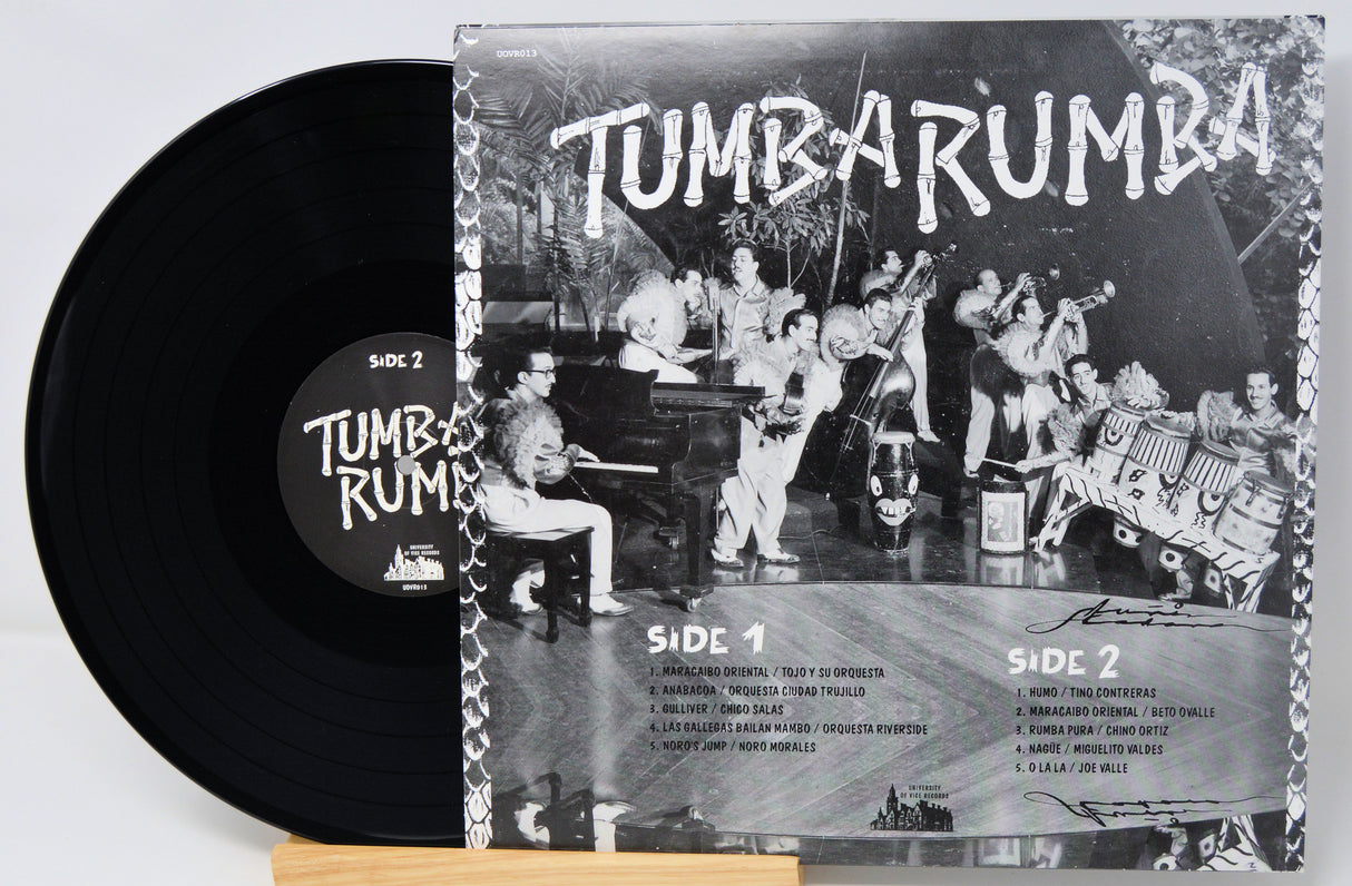 Vinyl record with cover featuring a band and text 'Tumba Rumba' on a light gray background.