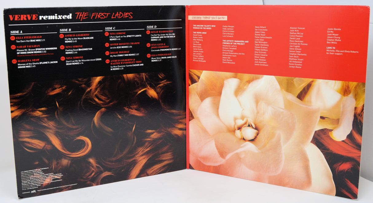 Vinyl record with artistic cover design featuring flames and a floral element.