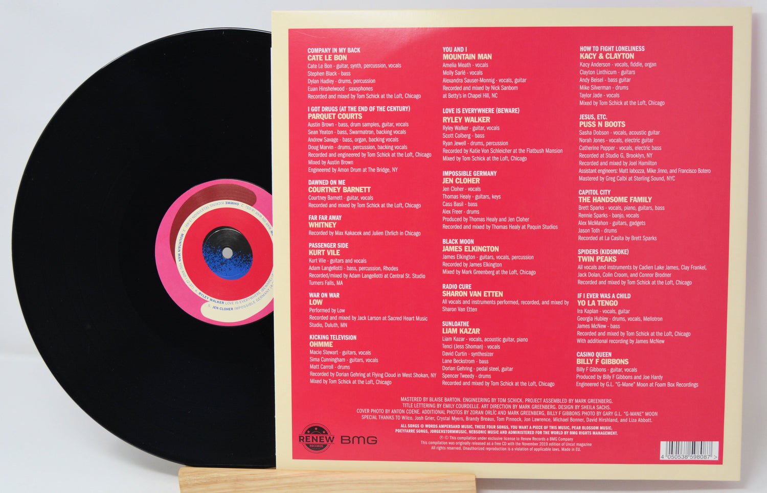 Vinyl record with a pink label on a white background