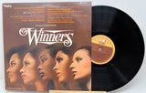 Vinyl record and cover titled 'Winners' with a focus on the album art and text.