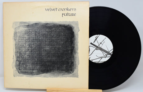 Vinyl record with cover titled 'Velvet Monkeys Future' on a light gray background