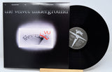 Vinyl record with cover featuring 'the velvet underground' and 'VU' logo.