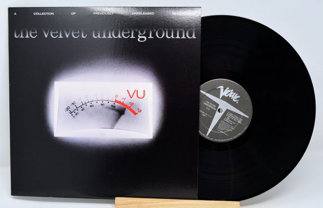 Vinyl record with cover featuring 'the velvet underground' and 'VU' logo.