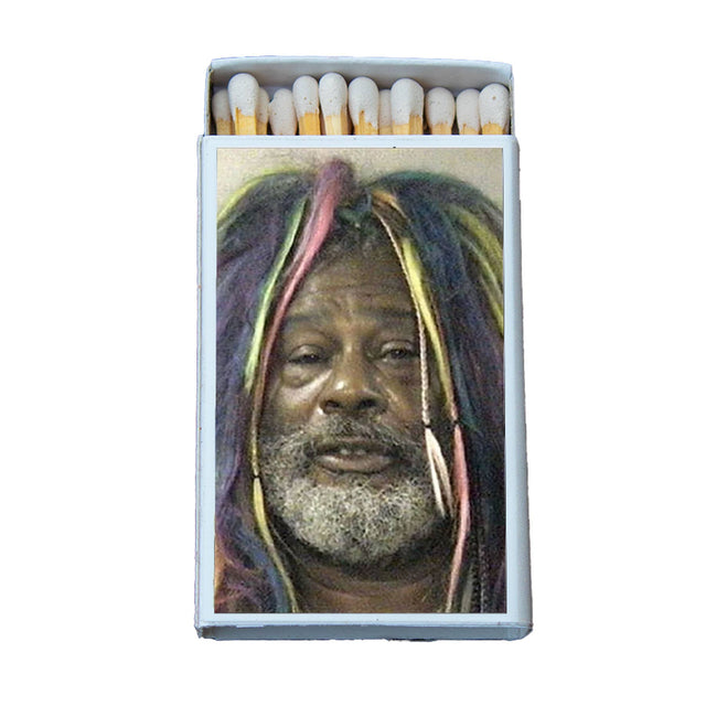 Box of matches featuring a colorful portrait of a man with rainbow dreadlocks and a gray beard