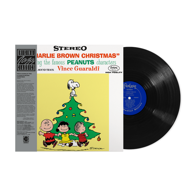 Vinyl record album for 'Jarlie Brown Christmas' sound track by Vince Guaraldi, featuring the illustrated cover with Peanuts characters and a black vinyl record partially pulled out, shown on a white background.